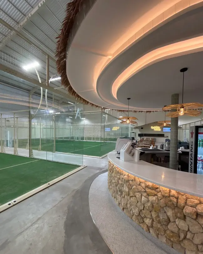 The curved bar along the courts