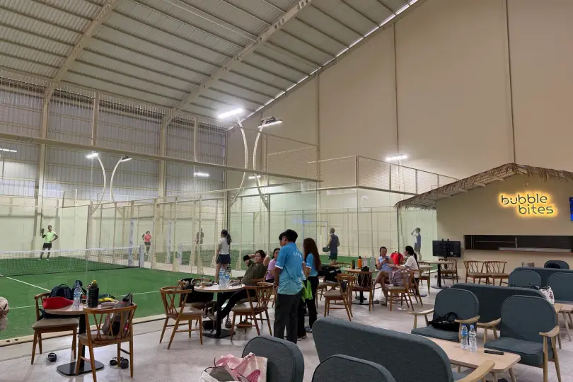 Lounge seating beside the courts with Bubble Bites behind