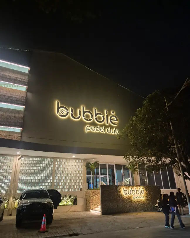 The lit Bubble sign at night