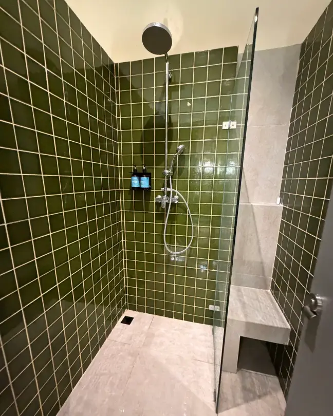Green-tiled rain shower